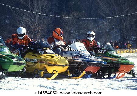 snowmobile, winter, Waitsfield, VT, Vermont, Drivers sit lined up with their snowmobiles to begin the Snowmobile Race at the Mad River Valley Winter Carnival in Waitsfield in winter. View Large Photo Image Stock Image - snowmobile, winter, Waitsfield, VT, Vermont, Drivers sit lined up with their snowmobiles to begin the Snowmobile Race at the Mad River Valley Winter Carnival in Waitsfield in winter.. Fotosearch