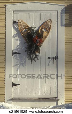 snowshoe, white door, close-up, Christmas, ribbon, holiday, decorations, winter, snow, Wooden snowshoes with greens and red bow hang on the old white outside door of the Inn at the Round Barn Farm in Waitsfield in Mad River Valley in the state of Vermont View Large Photo Image Stock Photography - snowshoe, white door, close-up, Christmas, ribbon, holiday, decorations, winter, snow, Wooden snowshoes with greens and red bow hang on the old white outside door of the Inn at the Round Barn Farm in Waitsfield in Mad River Valley in the state of Vermont. Fotosearch