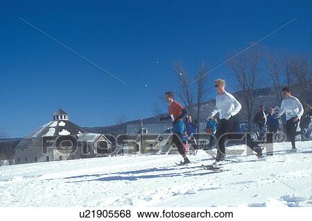 Stock Photo -  snowshoeing, winter, Waitsfield, VT, Vermont, Mad River Valley, Snowshoe Race at the Mad River Valley Winter Carnival at the Inn at the Round Barn Farm in Waitsfield in winter.. Fotosearch