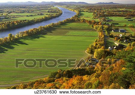 Stock Image -  South Deerfield, MA, Pioneer Valley, Massachusetts, The Connecticut River Valley, Aerial view of the scenic Pioneer Valley along the Connecticut River from Mt. Sugarloaf in South Deerfield in the autumn.. Fotosearch