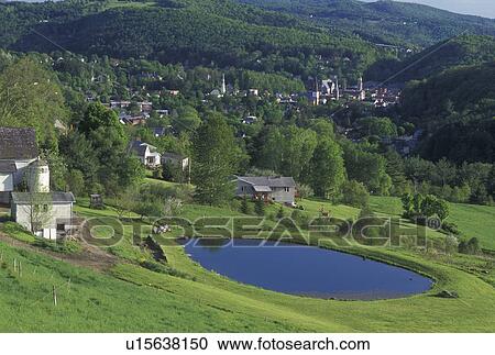 Stock Image -  spring, Montpelier, VT, Vermont, Scenic view of the city of Montpelier in the spring from a farm with a pond.. Fotosearch
