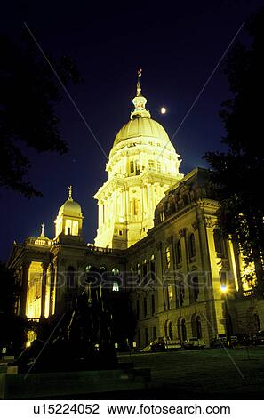 Stock Image -  Springfield, State Capitol, Statehouse, IL, Capitol, Illinois, The Illinois State Capitol building is illuminated in the evening in the capital city of Springfield, Illinois. . Fotosearch