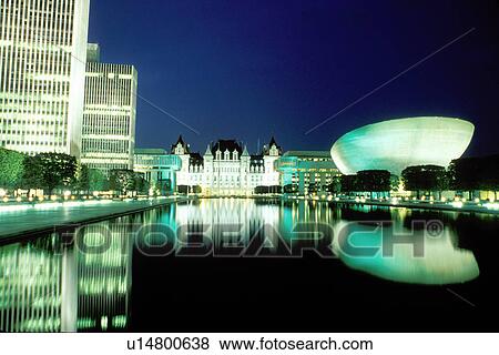 State Capitol, capitol, Albany, Statehouse, New York, Reflection of the State Capitol Building in the pool at the Governor Nelson A. Rockefeller Empire State Plaza illuminated at night in Albany, New York. View Large Photo Image Stock Photo - State Capitol, capitol, Albany, Statehouse, New York, Reflection of the State Capitol Building in the pool at the Governor Nelson A. Rockefeller Empire State Plaza illuminated at night in Albany, New York. . Fotosearch