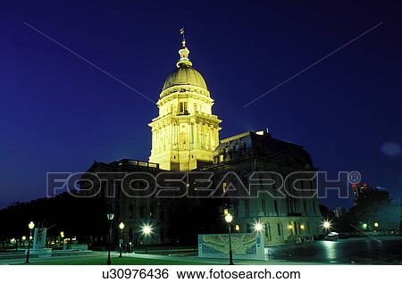 Stock Photograph -  State Capitol, dome, Springfield, Capitol, Statehouse, IL, Illinois, The dome of The Illinois State Capitol building is illuminated in the evening in the capital city of Springfield, Illinois. . Fotosearch