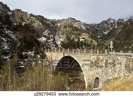 Stock Image -  stone bridge, Andorra, The Pyrenees, Europe, Pyrenees Mountains, road, bridge. Fotosearch