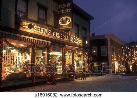 Stock Image -  Stowe, general store, country store, village, ski resort, decorations, holiday, Christmas, evening, snow, winter, Vermont, Shops along Main Street are decorated for the Christmas holiday season in the village of Stowe at night in Lamoille County in the s. Fotosearch