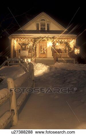 Stock Photo -  Stowe, holiday, gift shop, ski resort, evening, snow, decorations, Christmas, winter, Vermont, A boutique is decorated for the Christmas holiday season in Stowe Village on a snow covered night in Lamoille County in the state of Vermont. . Fotosearch