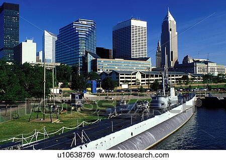 Stock Photo -  submarine, skyline, Cleveland, OH, Ohio, Downtown skyline of Cleveland, USS Cod Submarine Museum, Lake Erie. Fotosearch