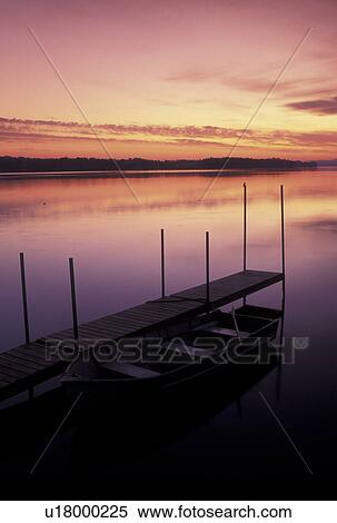 Stock Photography -  sunrise, rowboat, dock, Vermont, VT, South Hero, [Sunrise, sunset] on Keeler Bay on Lake Champlain.. Fotosearch