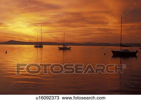 Stock Image -  sunrise, Vermont, VT, South Hero, [Sunrise, sunset] over Appletree Marina on Lake Champlain.. Fotosearch
