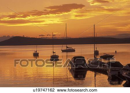 Stock Image -  sunrise, Vermont, VT, South Hero, [Sunrise, sunset] over Appletree Marina on Lake Champlain.. Fotosearch