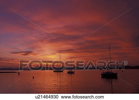 Stock Image -  sunrise, Vermont, VT, South Hero, [Sunrise, sunset] over Appletree Marina on Lake Champlain.. Fotosearch