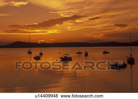 Stock Photo -  sunrise, Vermont, VT, South Hero, [Sunrise, sunset] over Appletree Marina on Lake Champlain.. Fotosearch