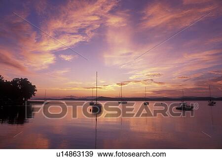 Stock Photo -  sunrise, Vermont, VT, South Hero, [Sunrise, sunset] over Appletree Marina on Lake Champlain.. Fotosearch