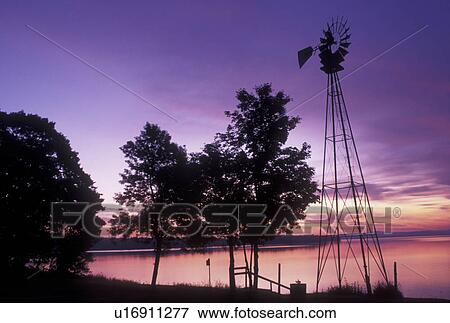 Stock Photo -  sunrise, windmill, Vermont, VT, South Hero, [Sunrise, sunset] on Keeler Bay on Lake Champlain.. Fotosearch