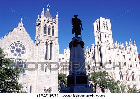 Stock Image -  Syracuse, New York, NY, Columbus Monument surrounded by churches in downtown Syracuse.. Fotosearch