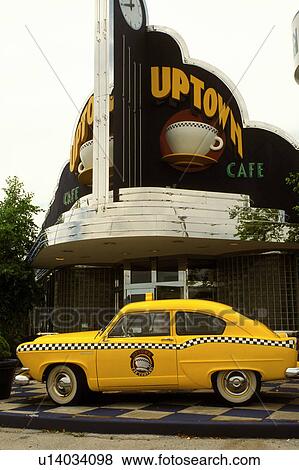 Stock Photo -  taxi, cafT, Branson, MO, Missouri, Antique yellow taxi cab is displayed outside the Uptown CafT in Branson.. Fotosearch