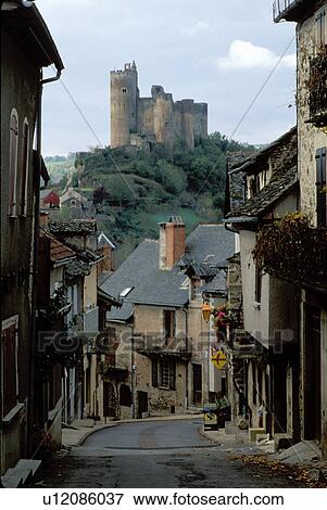 the Dordogne, castle, medieval, Quercy, Europe, France, Aveyron, Midi-Pyrenees, Najac, A narrow street runs through the medieval hilltop village of Najac. A castle sits on top of the hill in the distance. View Large Photo Image Stock Photo - the Dordogne, castle, medieval, Quercy, Europe, France, Aveyron, Midi-Pyrenees, Najac, A narrow street runs through the medieval hilltop village of Najac. A castle sits on top of the hill in the distance.. Fotosearch