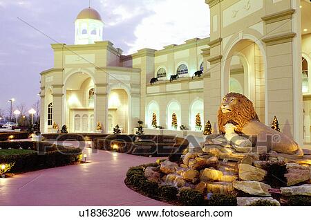 Stock Photograph -  theater, Lancaster County, Pennsylvania Dutch Country, Amish Country, PA, Pennsylvania, The Sight & Sound Millennium Theatre is illuminated at night in Strasburg.. Fotosearch