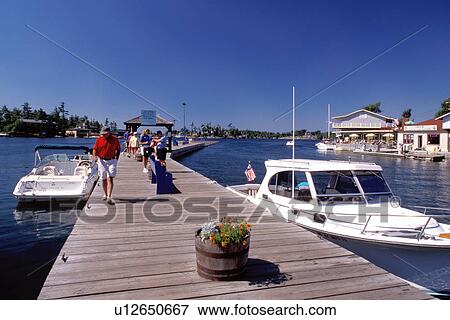 Thousand Islands, Alexandria Bay, New York, St. Lawrence River, NY, St. James Dock in Alexandria Bay along the St. Lawrence River. View Large Photo Image Stock Photo - Thousand Islands, Alexandria Bay, New York, St. Lawrence River, NY, St. James Dock in Alexandria Bay along the St. Lawrence River. . Fotosearch