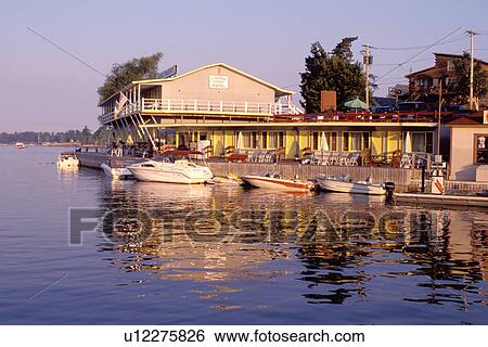 Stock Photograph -  Thousand Islands, inn, resort, lodge, country inn, Alexandria Bay, New York, St. Lawrence River, NY, Motel Resort in Alexandria Bay along the St. Lawrence River. . Fotosearch