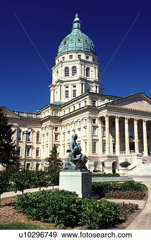 Stock Photo -  Topeka, State Capitol, State House, KS, Kansas, Statue of Pioneer Mother outside the State Capitol building in Topeka. The capitol, a French Renaissance style building.. Fotosearch