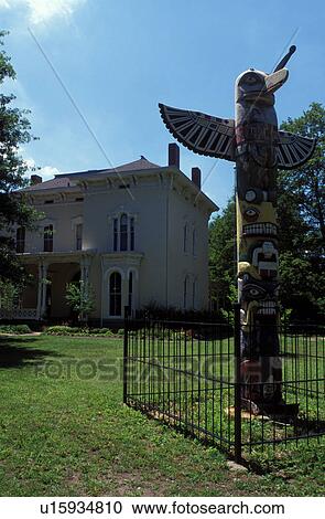 Stock Image -  totem pole, Terre Haute, IN, Indiana, totem pole outside the Historical Museum of the Wabash Valley. Fotosearch