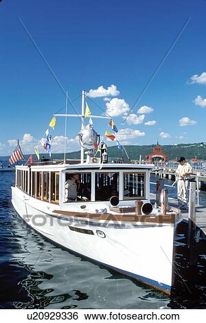 Stock Photograph -  tour boat, Watkins Glen, Finger Lakes, Seneca Lake, NY, New York, Captain Bill's Seneca Lake Cruise Boat is moored at the dock on Seneca Lake.. Fotosearch