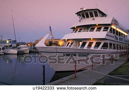 tourboat, Duluth, MN, Minnesota, Vista Fleet/Duluth-Superior Excursion boat moored at the dock in the evening in Duluth Harbor on Lake Superior in Duluth. View Large Photo Image Stock Image - tourboat, Duluth, MN, Minnesota, Vista Fleet/Duluth-Superior Excursion boat moored at the dock in the evening in Duluth Harbor on Lake Superior in Duluth.. Fotosearch