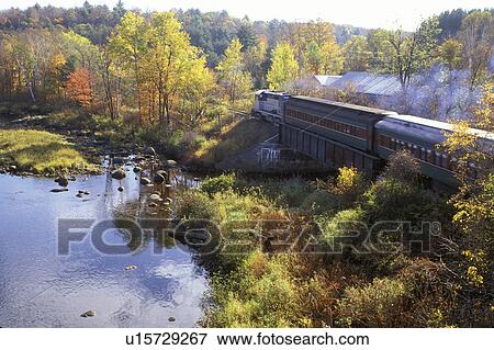 Stock Photo -  train, Adirondacks, North Creek, New York, NY, Upper Hudson River Valley Railroad excursion train transports visitors through the Adirondacks in the autumn.. Fotosearch