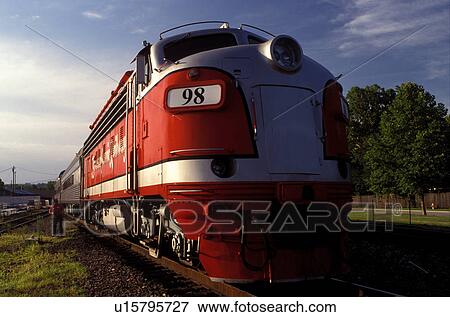 Stock Photo -  train, locomotive, scenic railway, Branson, MO, Missouri, A powerful red locomotive pulls the train at the Branson Scenic Railway in Branson.. Fotosearch