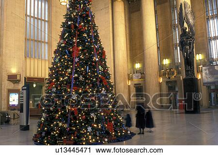 Stock Image -  train station, Amtrak, Philadelphia, Pennsylvania, PA, A Christmas tree decorated the ornate lobby of 30th Street Station for the holidays in downtown Philadelphia.. Fotosearch