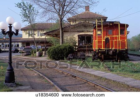 Stock Image -  train station, Canaan, Housatonic Valley, Lichtfield Hills, Connecticut, Red Caboose at Canaan Union Station in the historic district of Canaan.. Fotosearch