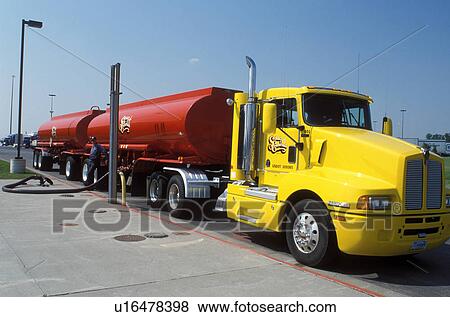 truck, gas, ND, North Dakota, Fargo, Red fuel truck with yellow cab fills gas into underground tanks at a gas station. View Large Photo Image Stock Photo - truck, gas, ND, North Dakota, Fargo, Red fuel truck with yellow cab fills gas into underground tanks at a gas station.. Fotosearch