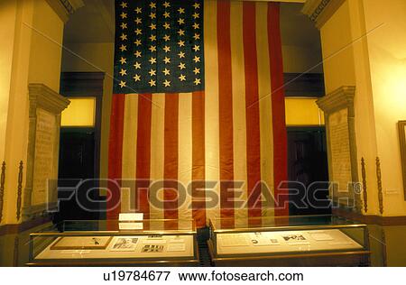 Stock Photo -  U. S. Flag, State Capitol, Arizona, Phoenix, State House, AZ, The American Flag hangs inside the Arizona State Capitol Museum in the capital city of Phoenix. . Fotosearch