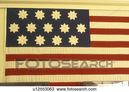 Stock Image -  U. S. Flag, State House, Annapolis, State Capitol, MD, Maryland, Replica of the United States Flag with 13 colonies by John Shaw in 1783 displayed in the Maryland Silver Room at the Maryland State House in the capital city of Annapolis.. Fotosearch