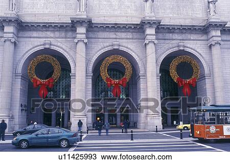 Union Station, Washington, DC, District of Columbia, Large Christmas wreaths decorated with yellow lights and red bows hang above the archways at Union Station in Washington D. C. View Large Photo Image Stock Image - Union Station, Washington, DC, District of Columbia, Large Christmas wreaths decorated with yellow lights and red bows hang above the archways at Union Station in Washington D. C.. Fotosearch