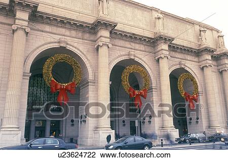 Union Station, Washington, DC, District of Columbia, Large Christmas wreaths decorated with yellow lights and red bows hang above the archways at Union Station in Washington D. C. View Large Photo Image Stock Image - Union Station, Washington, DC, District of Columbia, Large Christmas wreaths decorated with yellow lights and red bows hang above the archways at Union Station in Washington D. C.. Fotosearch