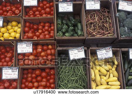 Stock Image -  vegetable, outdoor market, produce, Vermont, VT, Fruit and vegetables displayed in baskets at the Saturday Farmers Market in Montpelier. . Fotosearch