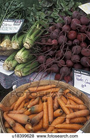 Stock Photo -  vegetables, outdoor market, produce, Vermont, VT, Carrots, beets, and celery for sale at the Farmers Market in Waterbury. . Fotosearch