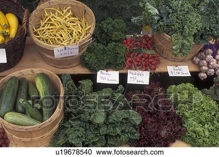 Stock Image -  vegetables, produce, outdoor market, Vermont, VT, Vegetables displayed in crates for sale at the Saturday Farmers Market in Montpelier. . Fotosearch
