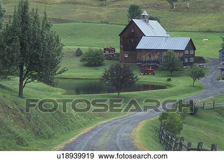 Stock Photo -  Vermont, barn, VT, Sleepy Hollow Farm in South Pomfret. Two red tractors parked outside barn.. Fotosearch