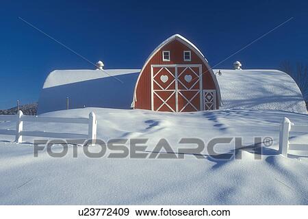 Stock Photo -  Vermont, red barn, VT, Snow-covered, red barn with white trim, Diamond Heart Farm, East Albany, winter.. Fotosearch