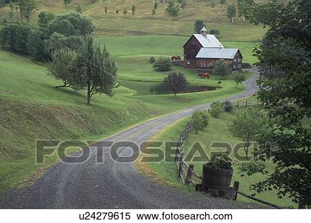 Stock Photography -  Vermont, VT, Country lane leads down to Sleepy Hollow Farm in Pomfret. Two red tractors parked outside barn . Fotosearch