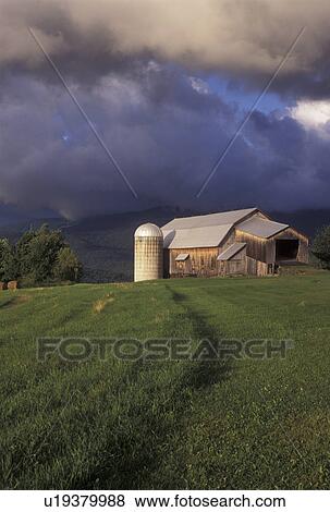 Stock Photo -  Vermont, VT, Storm clouds over the Green Mountains and Bragg Farm in Fayston . Fotosearch