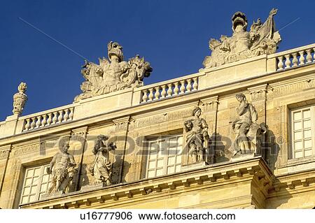 Stock Photograph -  Versailles, France, Yvelines, Ile de France, Paris, Europe, Ornate statues on top of Chateau de Versailles.. Fotosearch