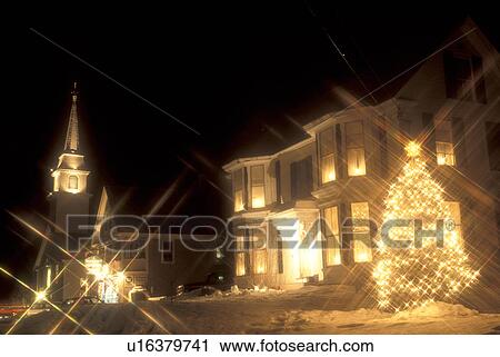 Stock Image -  village, town, church, decorations, holiday, outdoor, snow, winter, The village of East Corinth is decorated for the Christmas holiday season at night in Orange County in the state of Vermont. . Fotosearch