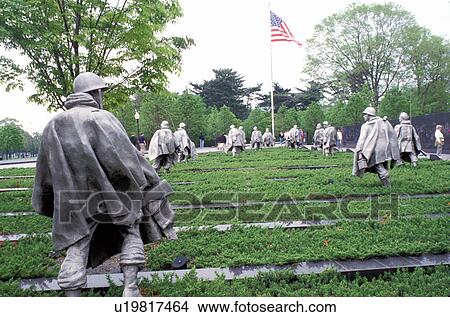 Picture -  Washington, DC, District of Columbia, Statues of soldiers in ponchos in a rice paddy field at the Korean War Veterans Memorial.. Fotosearch