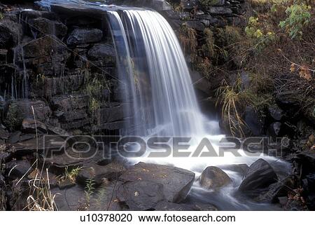 waterfall, cascade, A sheet of water cascades down over rocks in a small river in North Calais in Washington County in the state of Vermont View Large Photo Image Stock Image - waterfall, cascade, A sheet of water cascades down over rocks in a small river in North Calais in Washington County in the state of Vermont . Fotosearch