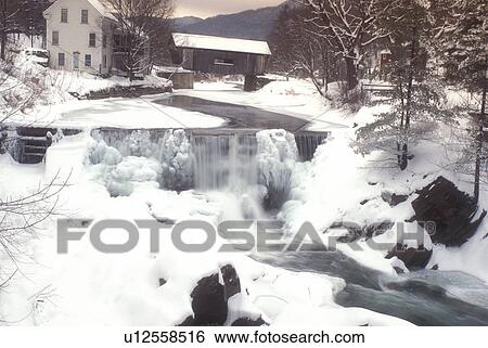 waterfall, covered bridge, frozen, ice, river, winter, snow, Mad River Valley, Warren Covered Bridge c. 1880 crosses over the Mad River as it flows over the ice covered wall of rocks on on a wintry day in Warren in Washington County in the state of Vermo View Large Photo Image Stock Photograph - waterfall, covered bridge, frozen, ice, river, winter, snow, Mad River Valley, Warren Covered Bridge c. 1880 crosses over the Mad River as it flows over the ice covered wall of rocks on on a wintry day in Warren in Washington County in the state of Vermo. Fotosearch
